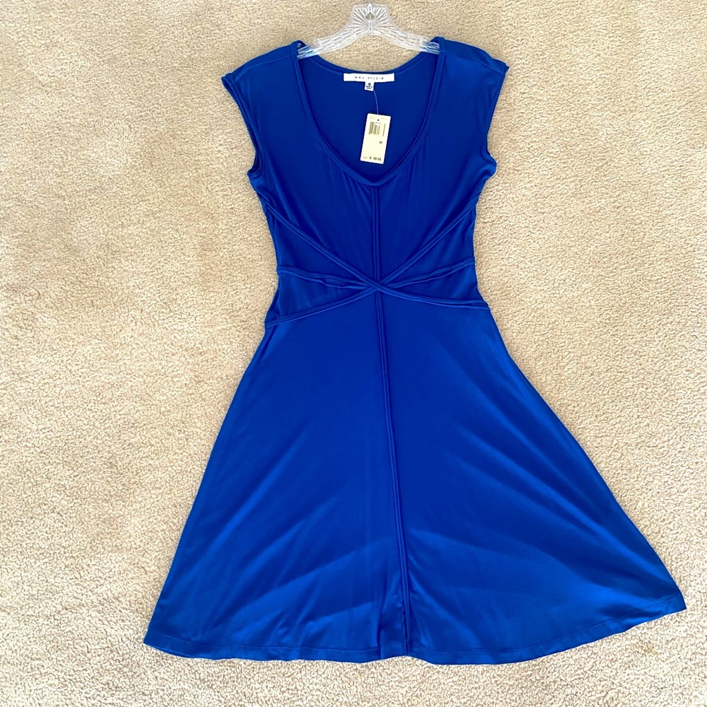 A-line flaring new kobalt figure slimming dress. Cap sleeve